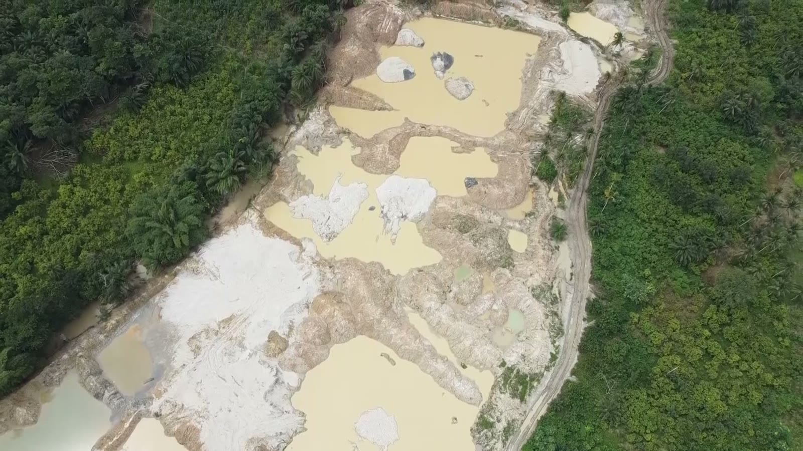 Aerial view of farmland scarred by illegal mining