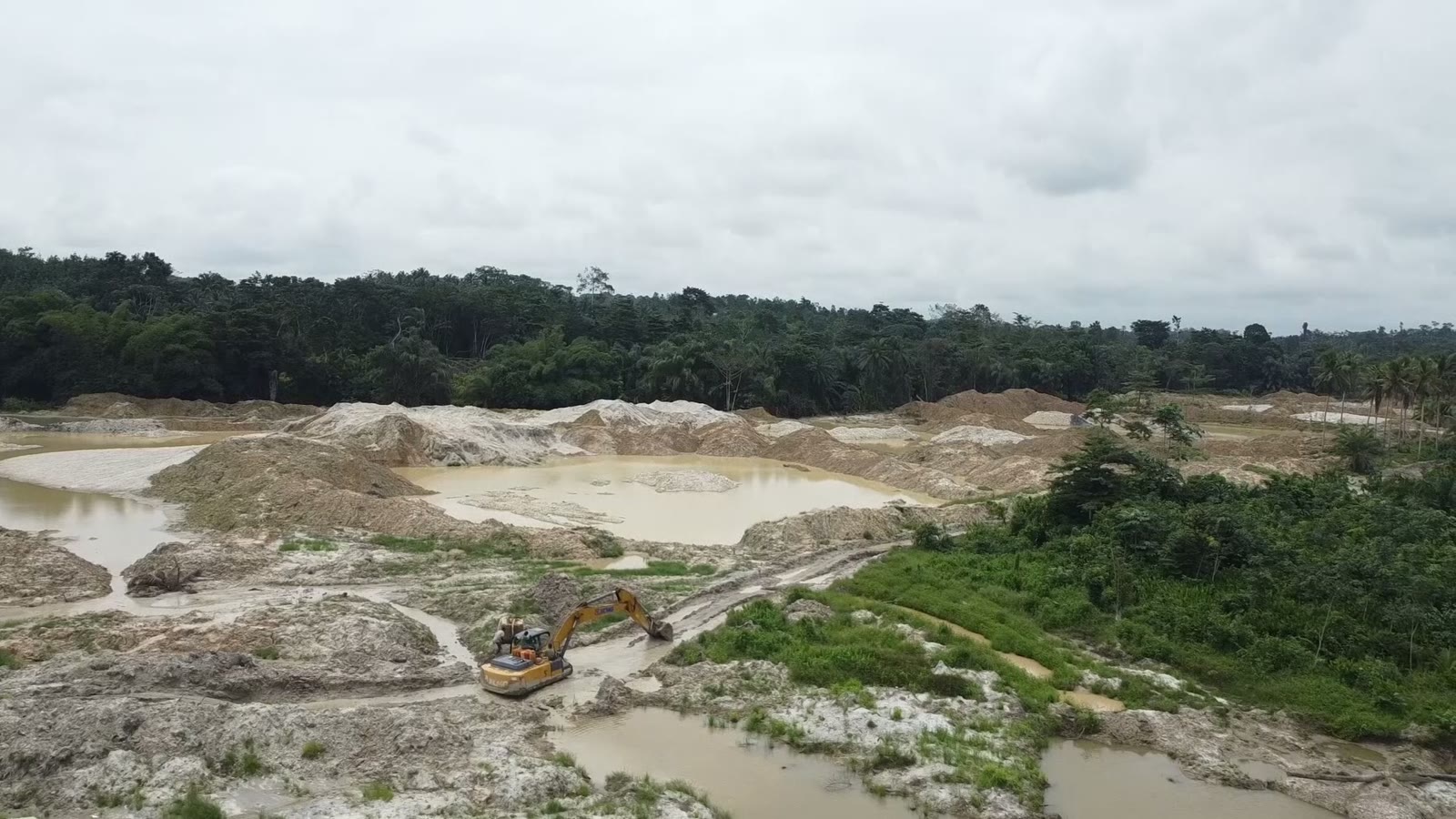 An excavator working an illegal mining site